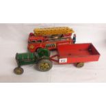 A Mettoy tinplate clockwork tractor and trailer, and a tinplate friction fire engine.