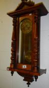 A mahogany wall clock.