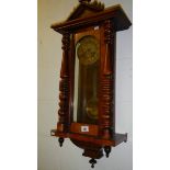 A mahogany wall clock.