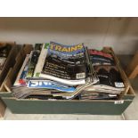 A box of Train magazines.