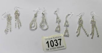 4 pairs of crystal drop earrings.