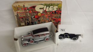 2 boxed model cars and 4 Giles books.