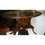 A glass topped occasional table.