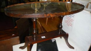 A glass topped occasional table.