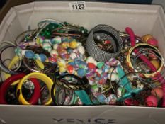 A box of assorted costume jewellery.