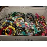 A box of assorted costume jewellery.