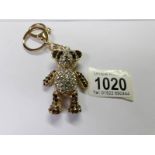 A jointed jewel set teddy bear as a key ring.