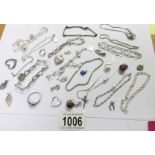 A quantity of silver pendants, bracelets etc.