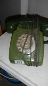 A vintage dial telephone.