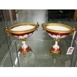A pair of continental porcelain urns, a/f.