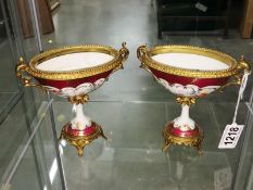 A pair of continental porcelain urns, a/f.