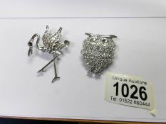 A jewelled owl brooch and a jewelled stork brooch.