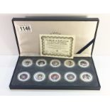 A cased set of 10 official Elvis Presley colourized state quarters with certificate.