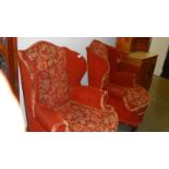 A pair of wing arm chairs.