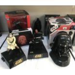 A collection of electronic Star Wars items including talking Banks and Darth Vader radio and CD