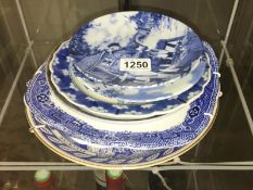 A quantity of blue and white plates.
