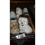 A pair of miniature Staffordshire dogs and a pair of china shoes.
