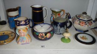 A shelf of assorted jugs, bowls, teapot, teapot stands etc.