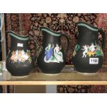 A set of 3 graduated jugs with Grecian scenes.