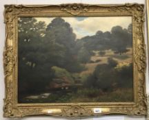 A 19th century oil on canvas 'landscape with a river in foreground' signed M.