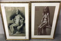 A pair of framed & glazed 1950's studio stamped colouring graphite drawings 'seated nudes' by John