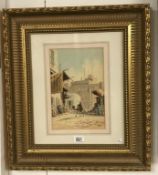A framed & glazed watercolour 'Middle East city scene' initialed in gilt frame.
