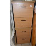 A pair of 2 drawer filing cabinets