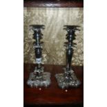 A pair of silver plated candlesticks.