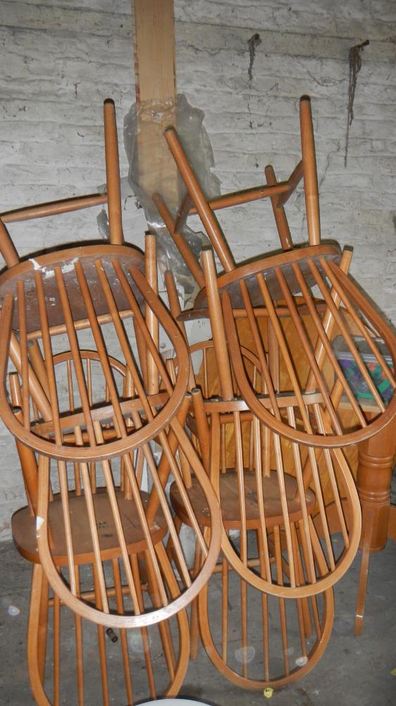 A pine table and six chairs