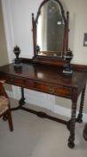 A walnut dressing table with barley twist supports