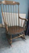 A spindle back rocking chair