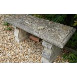 A stone garden bench