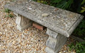 A stone garden bench