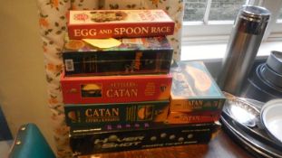 A mixed lot of games, 'Catan Cities & Knights' unopened, murder mystery etc.