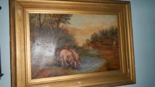 A gilt framed oil on canvas painting of horses in a stream.