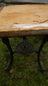 An old cast aluminium triple legged table - top a/f