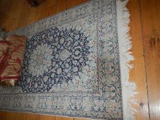 An Eastern silk rug.