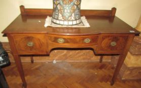 A mahogany inlaid writing desk.