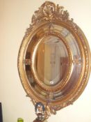 A fine oval gilt partitioned mirror