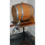 A large oak beer barrel with tap