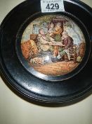 A rare framed Pratt ware pot lid.