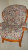 A cottage style two seater wood framed settee and armchair