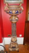 A tall blue late 19th/early 20th century majolica style jardiniere on stand.