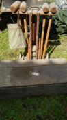 A croquet set complete with box and archery set including bows,