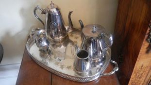 A 4 piece silver plate tea set on tray.