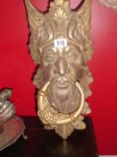 A large Green Man door knocker