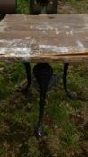 An old cast aluminium triple legged table - top a/f