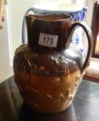 A Doulton stoneware harvest jug.