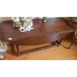 A period oak drop leaf table.