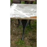 An old cast aluminium triple legged table - top a/f